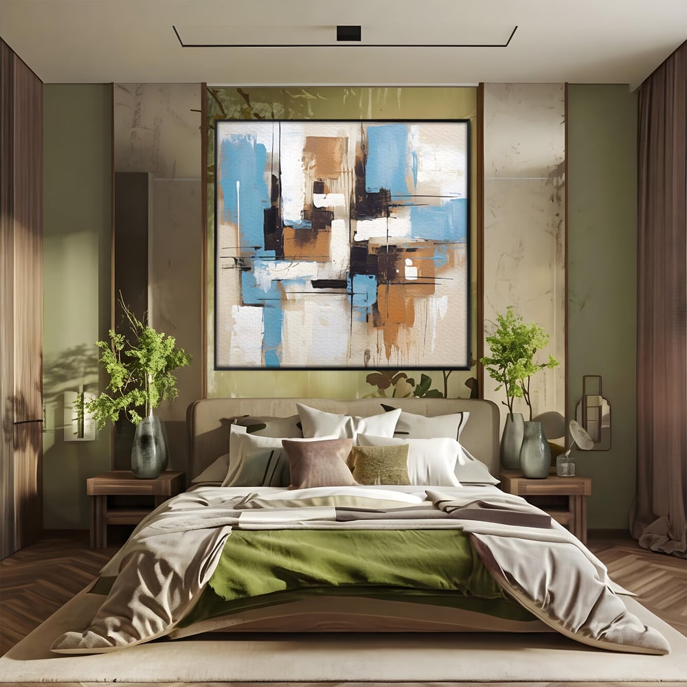 Tablou canvas cu pictura abstracta cu forme geometrice albastre, in rama de aluminiu negru, pe perete intr-un dormitor